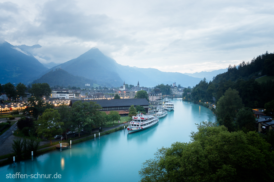 mountains
 ship
 river
 Switzerland
