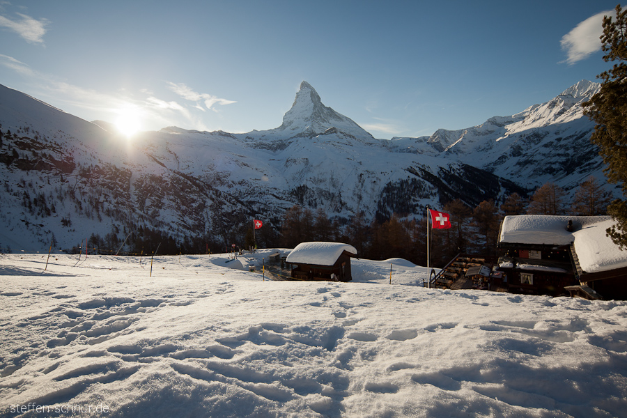 snow
 flag
 cabins
 Matterhorn
 Switzerland
 sun
 Wallis
