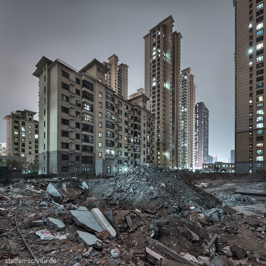 Shenyang
 building lot
 skyscrapers
 night
 debris
 block of flats
 gray
