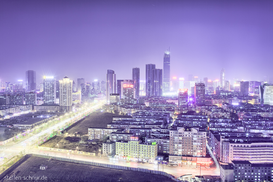 city skyline
 cars
 highway
 Shenyang
 China
 light trails
 night
