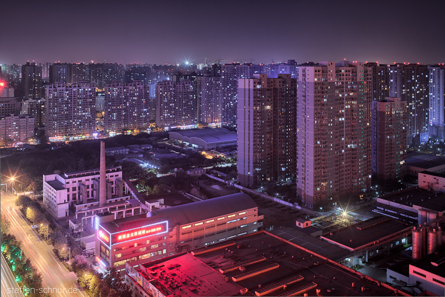 Xian
 China
 factory
 skyscrapers
 night
 fluorescent light
 chimney
