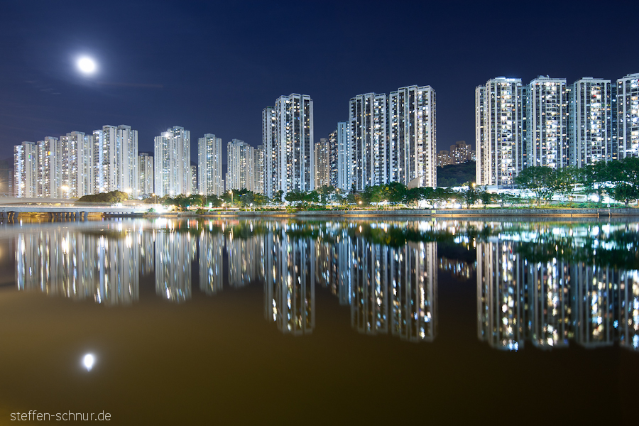 moon
 Hong Kong
 China
 river
 mirroring
 residential towers
