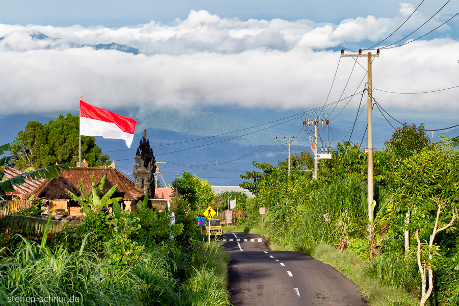 mountains
 Bali
 Indonesia
 street
 power line
 clouds
 Indonesian flag
