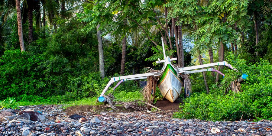 abandoned
 Bali
 Indonesia
 Boat
 palms
 stones
