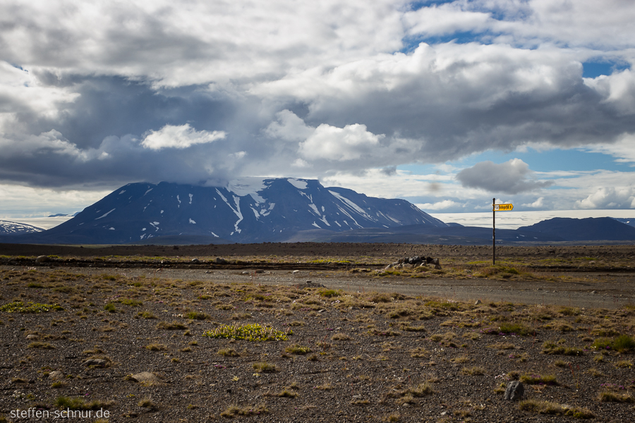 mountain
 highland
 Iceland
 intersection
 shield
 street
 clouds

