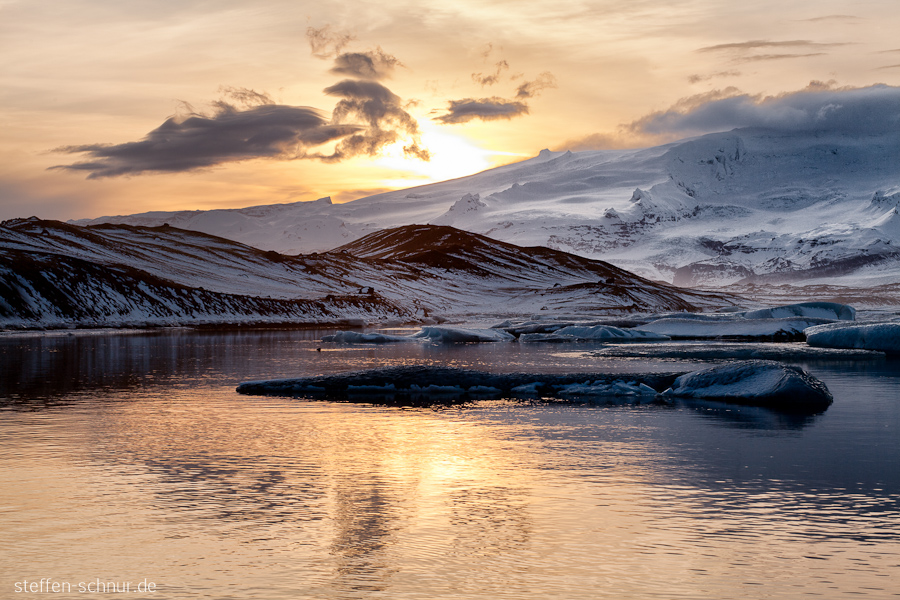 mountains
 Iceland
 river
 sun
 clouds
