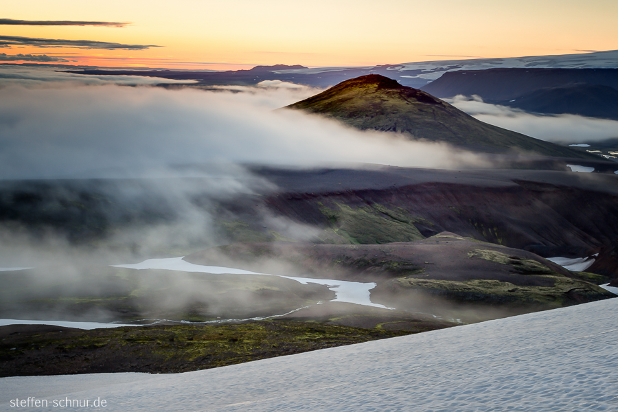 snow
 mountain
 sunrise
 highland
 Iceland
 fog
 clouds
