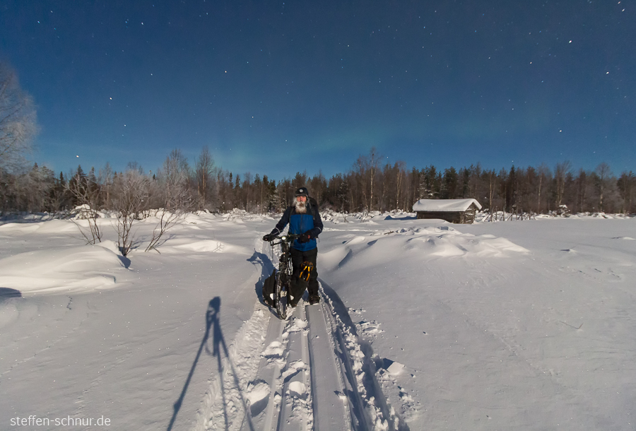 snow
 bike
 Lapland
 Finland
 cottage
 night
 shadow
