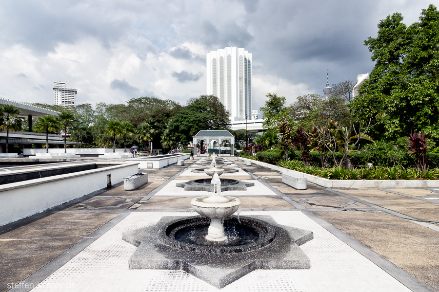 Kuala Lumpur
 Malaysia
 fountain
 mosque
 park
 clouds
