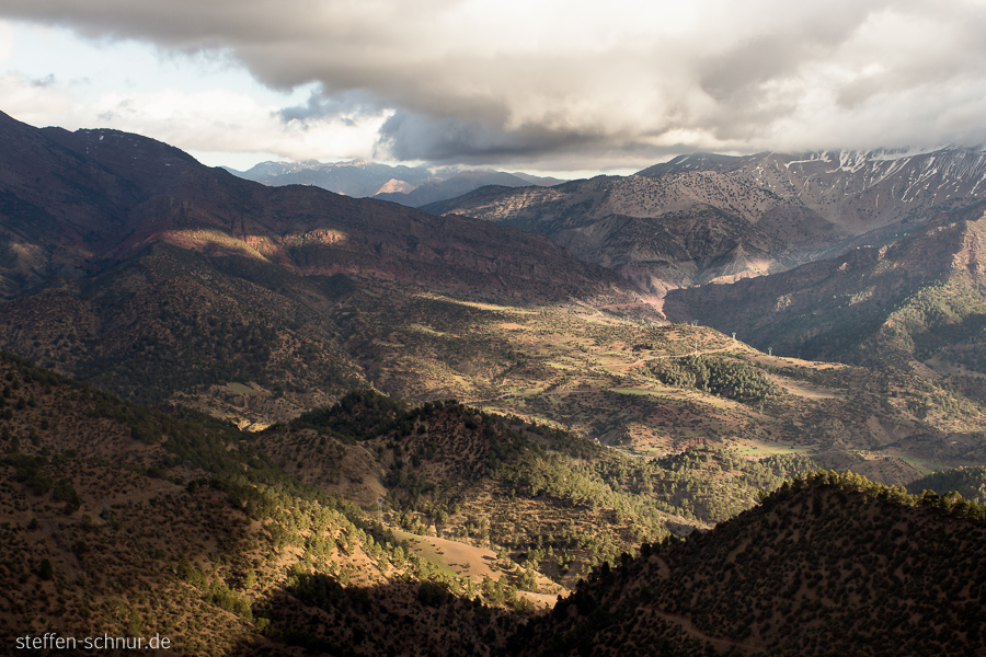 Morocco
 Mountain landscape
 High Atlas
 valley
 forest
 clouds

