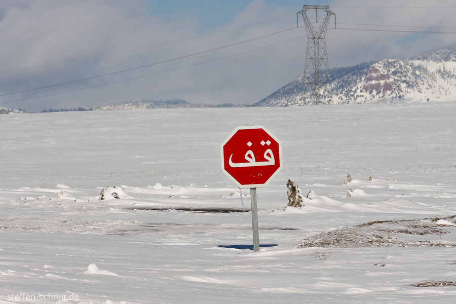 snow
 stop sign
 winter
 arabic
