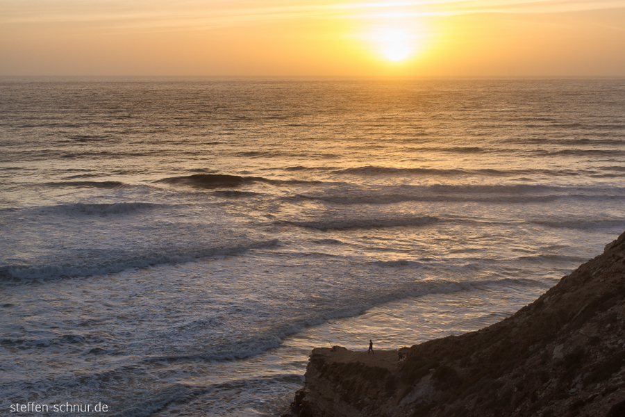 sunset
 Morocco
 fishing enthusiast
 rock
 coast
 sea
 waves
