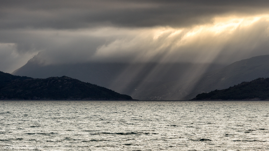 Norway
 sunlight
 blanket of clouds
