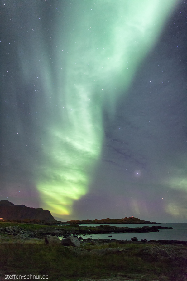 aurora borealis
 North Sea
 coast
 Lofoten
 Northern lights
 Norway
 stones
