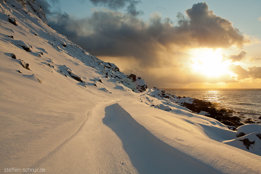 snow
 sunset
 Lofoten
 sea
 Norway
 sun
 way
