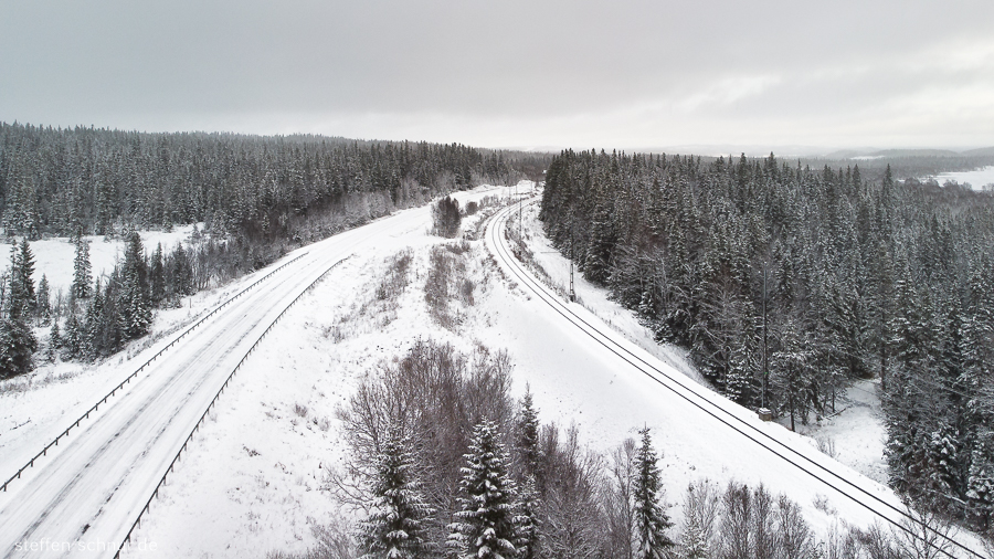 snow
 railroad track
 Sweden
 aerial photograph
 street
 forest
