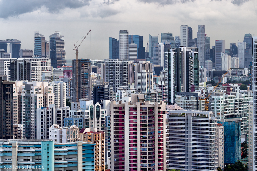 Singapore
 metropolis
 skyscrapers
 sea of houses
 close
