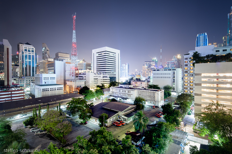 car park
 Bangkok
 Thailand
 antenna
 Trees
 skyscrapers
 night
