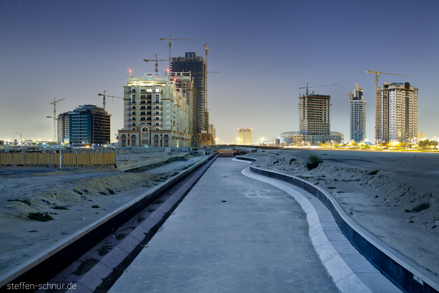 Construction project
 building lot
 Dubai
 river
 river
 cranes
 Sports City
